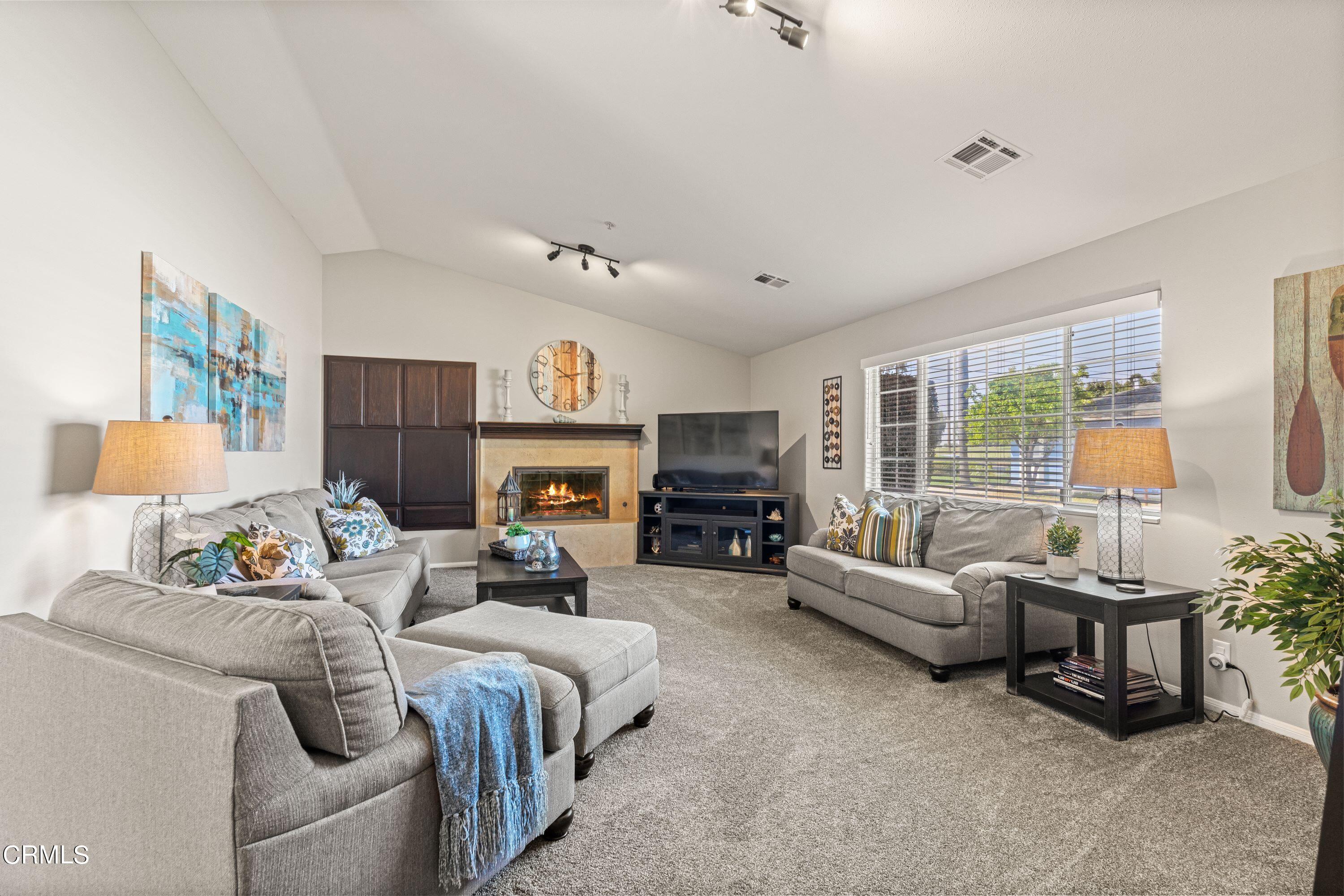 10975 Darling Road Ventura, CA 93004 - Photo 6 of 49 a living room with furniture fireplace and a large window