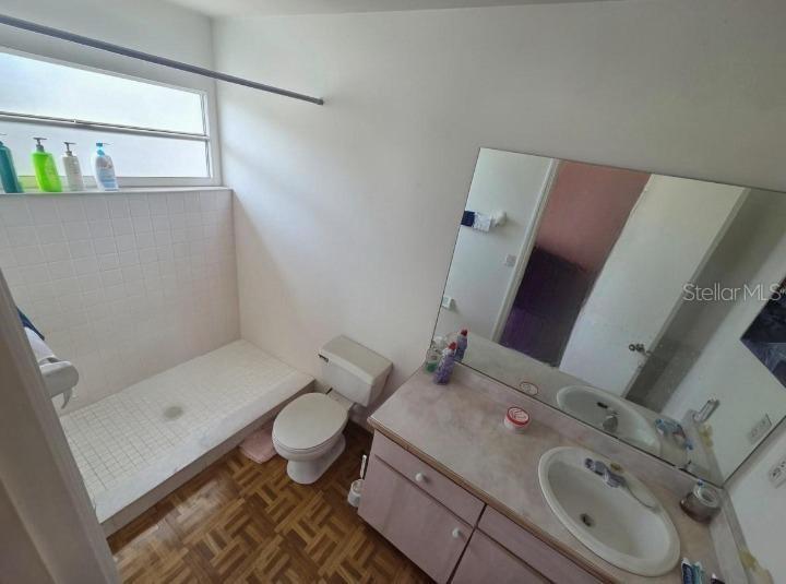 299 Indian Point Circle Kissimmee, FL 34746 - Photo 12 of 24 a bathroom with a sink and toilet