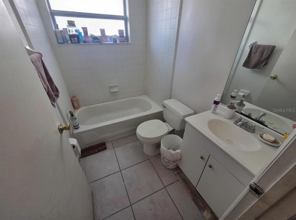 299 Indian Point Circle Kissimmee, FL 34746 - Photo 18 of 24 a bathroom with a sink a toilet and shower