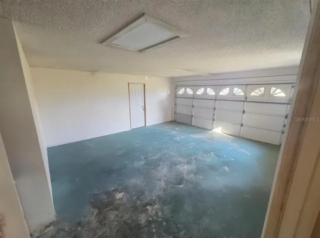 a view of a pathway of a house with wooden fence