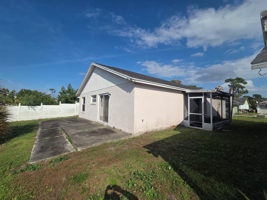 299 Indian Point Circle Kissimmee, FL 34746 - Photo 23 of 24 a view of house with backyard and garden