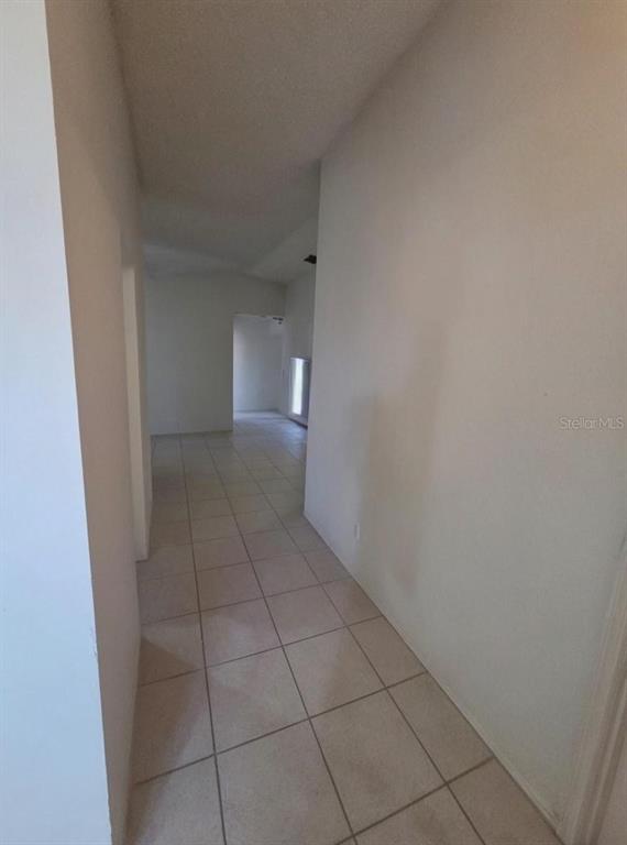 299 Indian Point Circle Kissimmee, FL 34746 - Photo 6 of 24 a view of an empty room and window