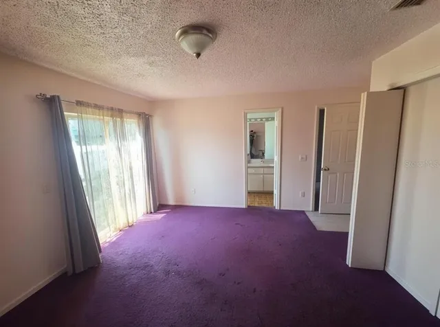 a view of empty room with front door