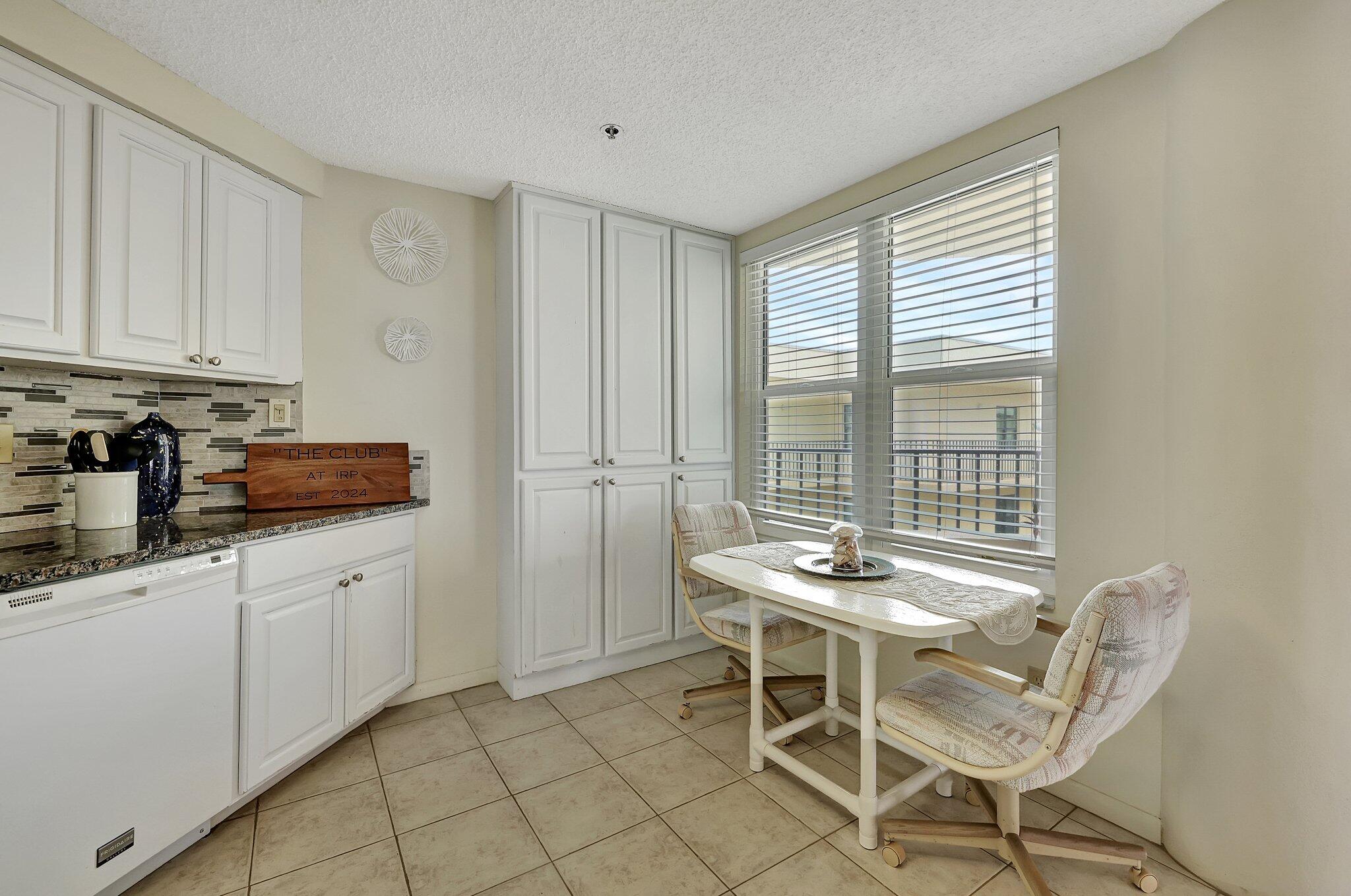 221 Northeast Plantation Road, Unit 406 Stuart, FL 34996 - Photo 11 of 58 a dining room with furniture and window