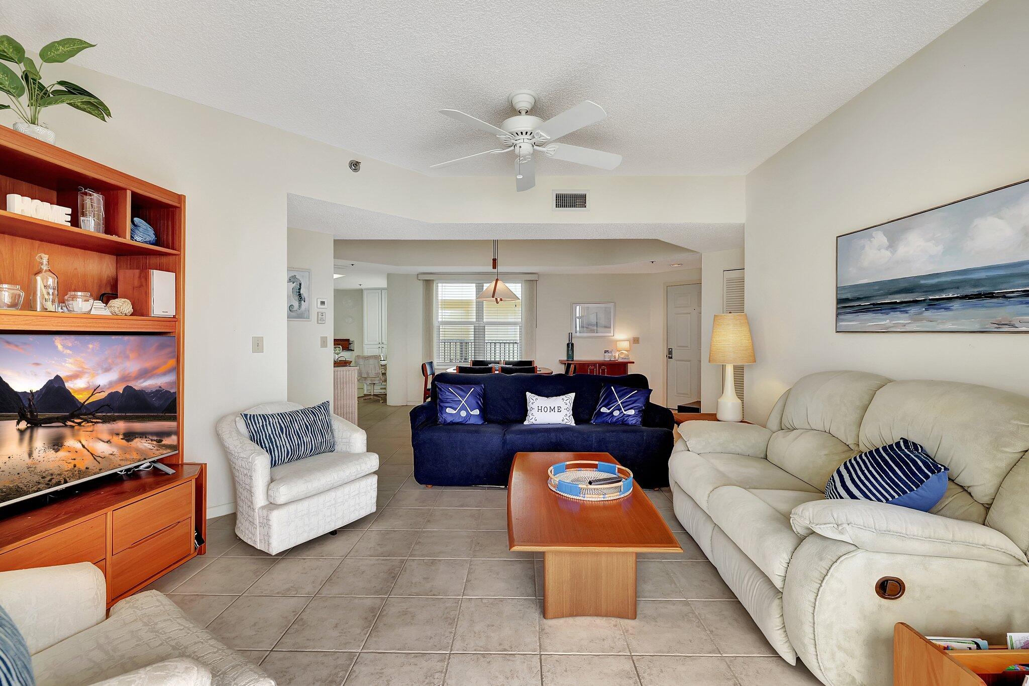 221 Northeast Plantation Road, Unit 406 Stuart, FL 34996 - Photo 16 of 58 a living room with furniture kitchen view and a window
