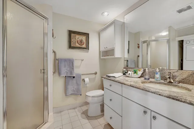 a bedroom with a bed and a view of balcony