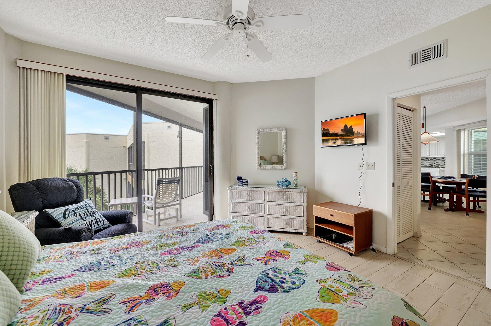 221 Northeast Plantation Road, Unit 406 Stuart, FL 34996 - Photo 27 of 58 a bedroom with furniture and a bed