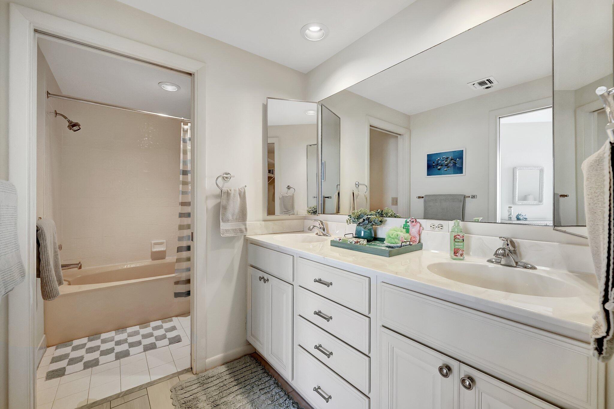 221 Northeast Plantation Road, Unit 406 Stuart, FL 34996 - Photo 28 of 58 a bathroom with a sink a toilet and shower