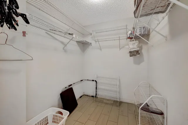 a bedroom with bed and window