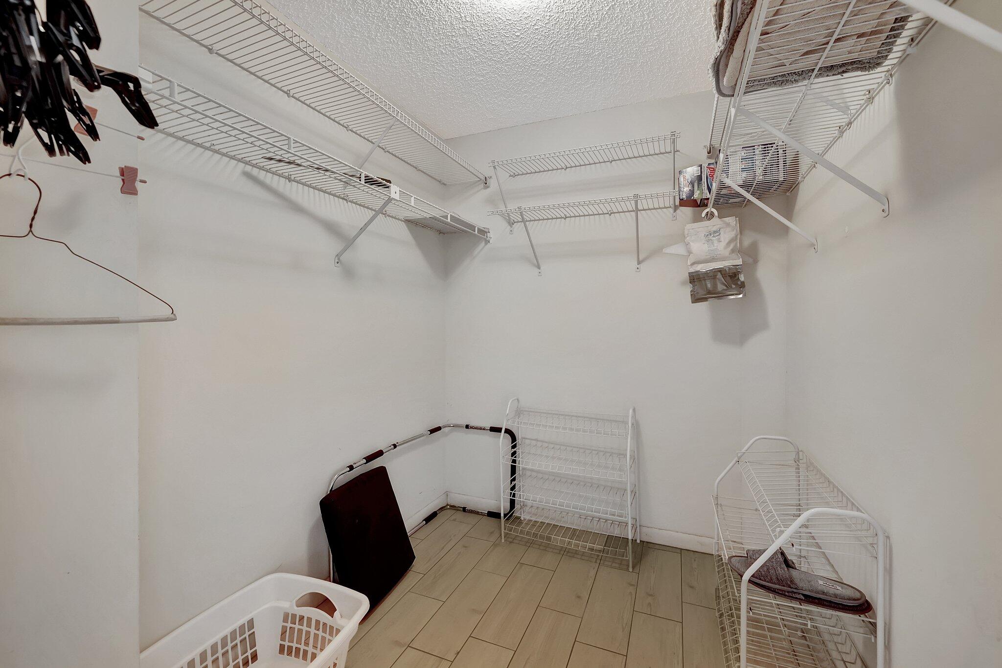 221 Northeast Plantation Road, Unit 406 Stuart, FL 34996 - Photo 30 of 58 a view of a room with racks on the wall