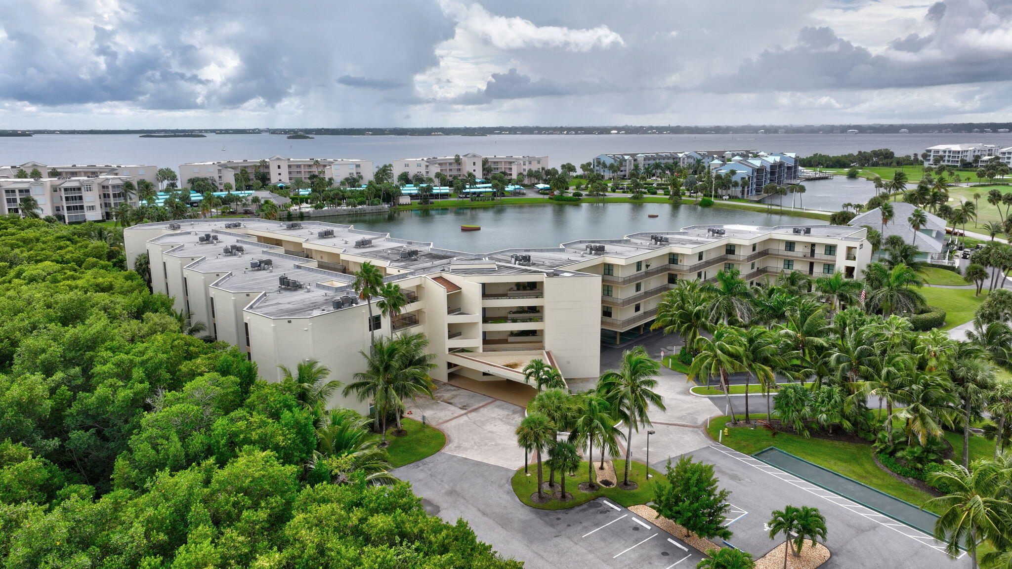 221 Northeast Plantation Road, Unit 406 Stuart, FL 34996 - Photo 41 of 58 a view of a lake with houses