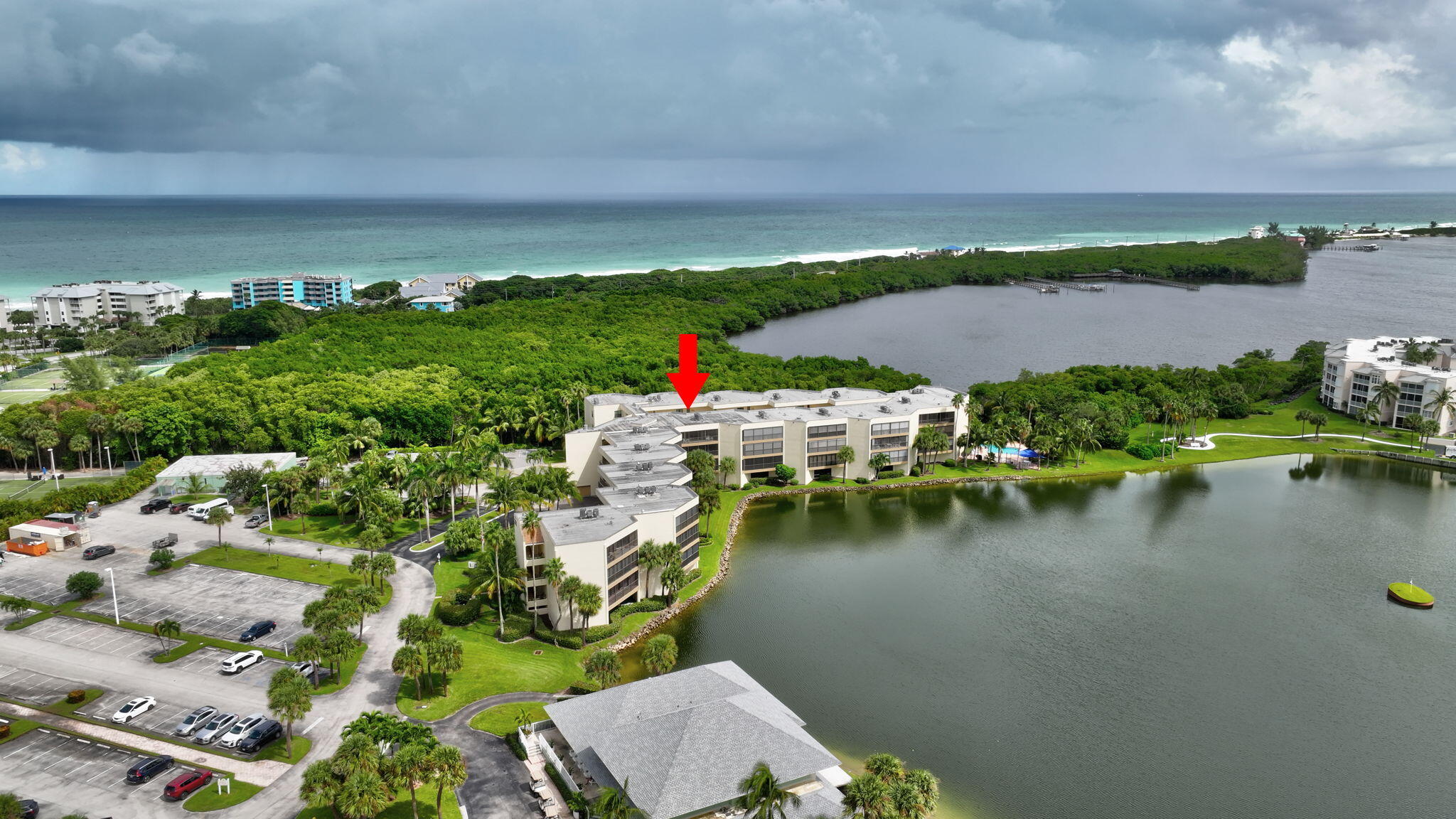 221 Northeast Plantation Road, Unit 406 Stuart, FL 34996 - Photo 50 of 58 an aerial view of house yard swimming pool and outdoor seating