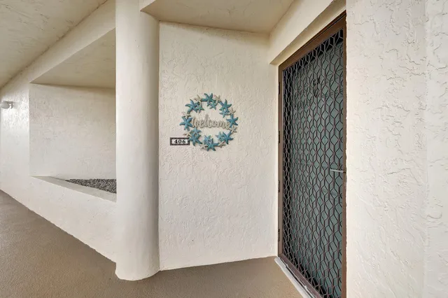 a view of a hallway with wooden floor and a hallway