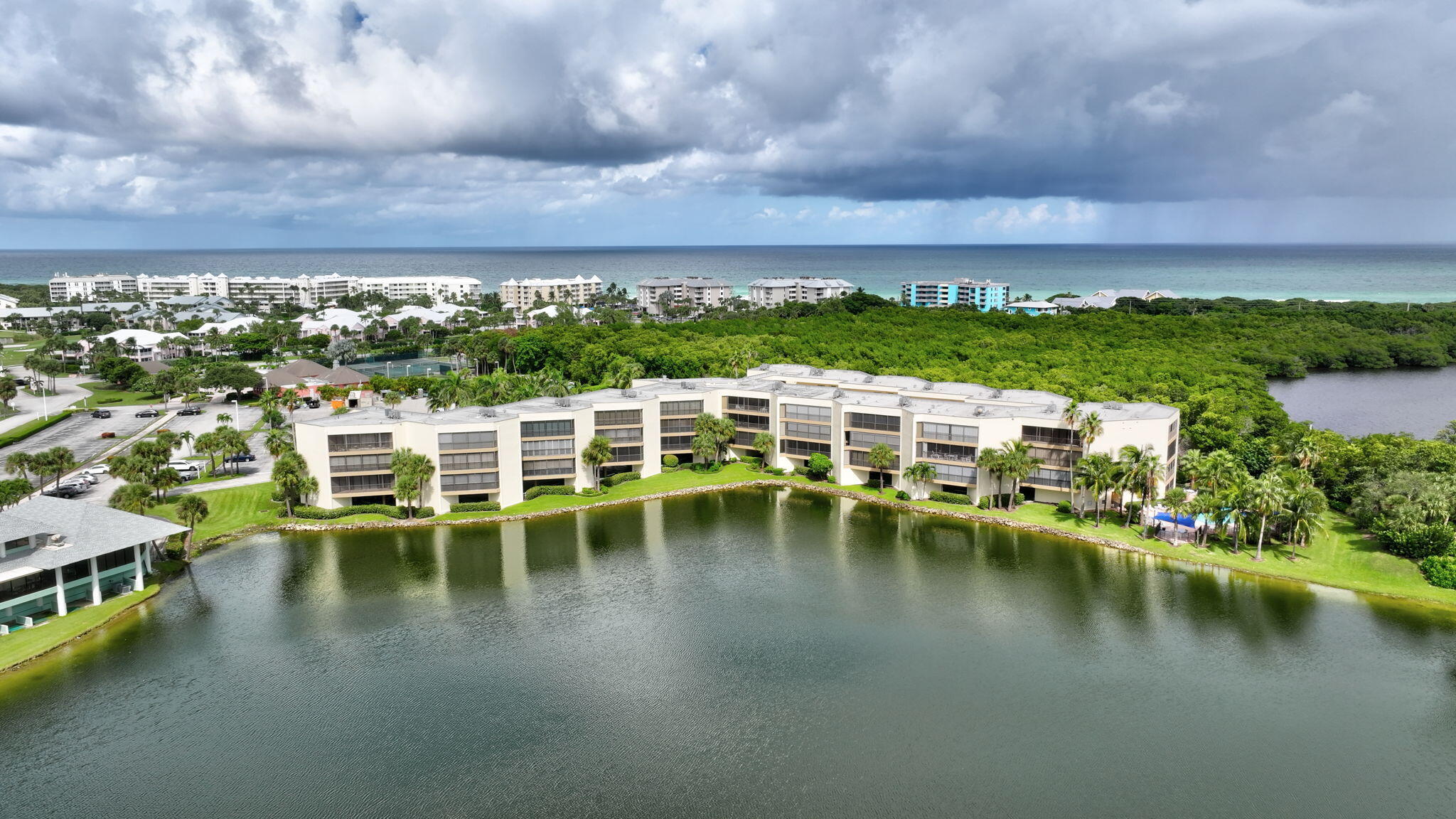 221 Northeast Plantation Road, Unit 406 Stuart, FL 34996 - Photo 51 of 58 a view of a lake with a mountain in the background