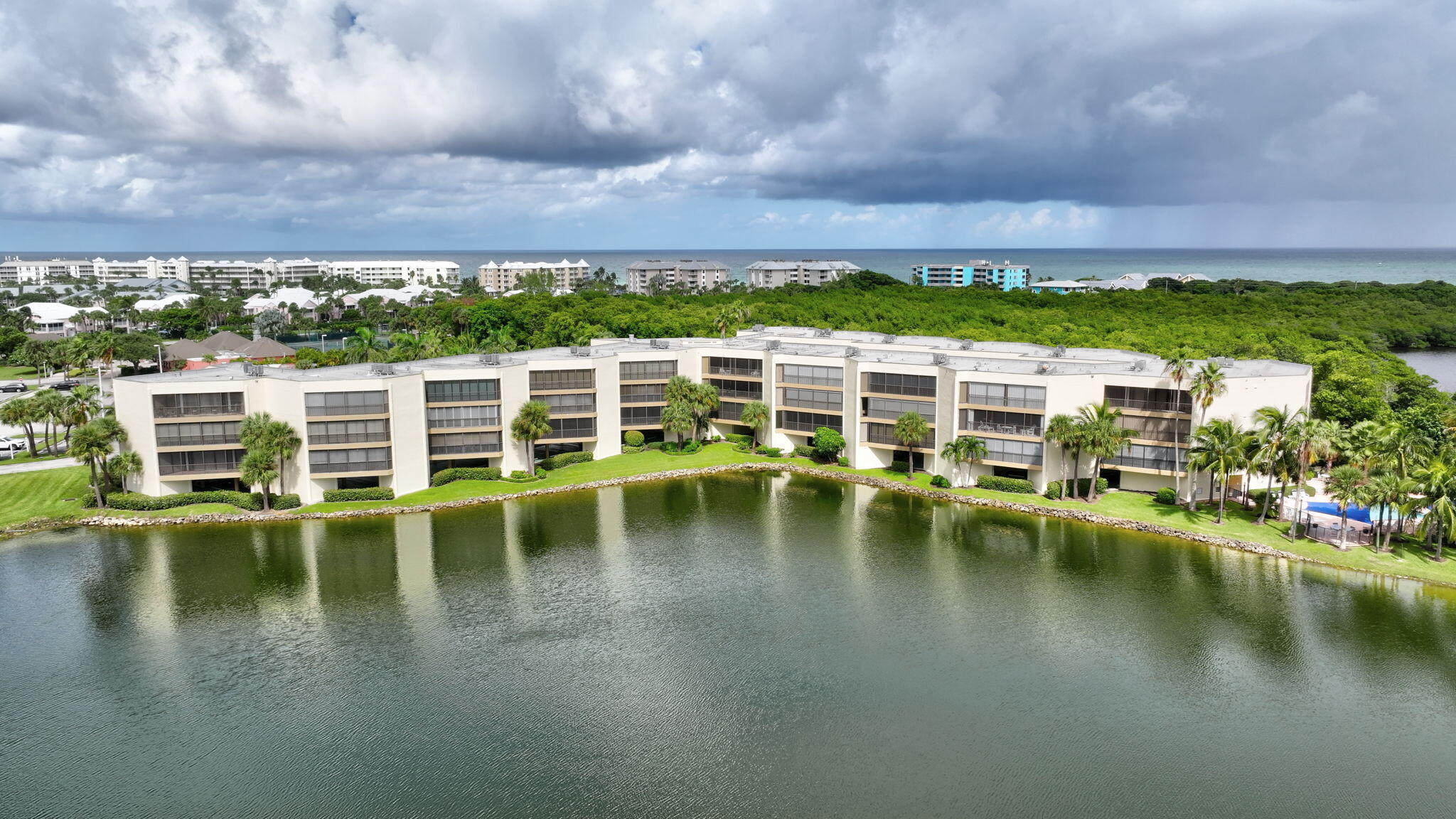 221 Northeast Plantation Road, Unit 406 Stuart, FL 34996 - Photo 52 of 58 a view of swimming pool with outdoor seating
