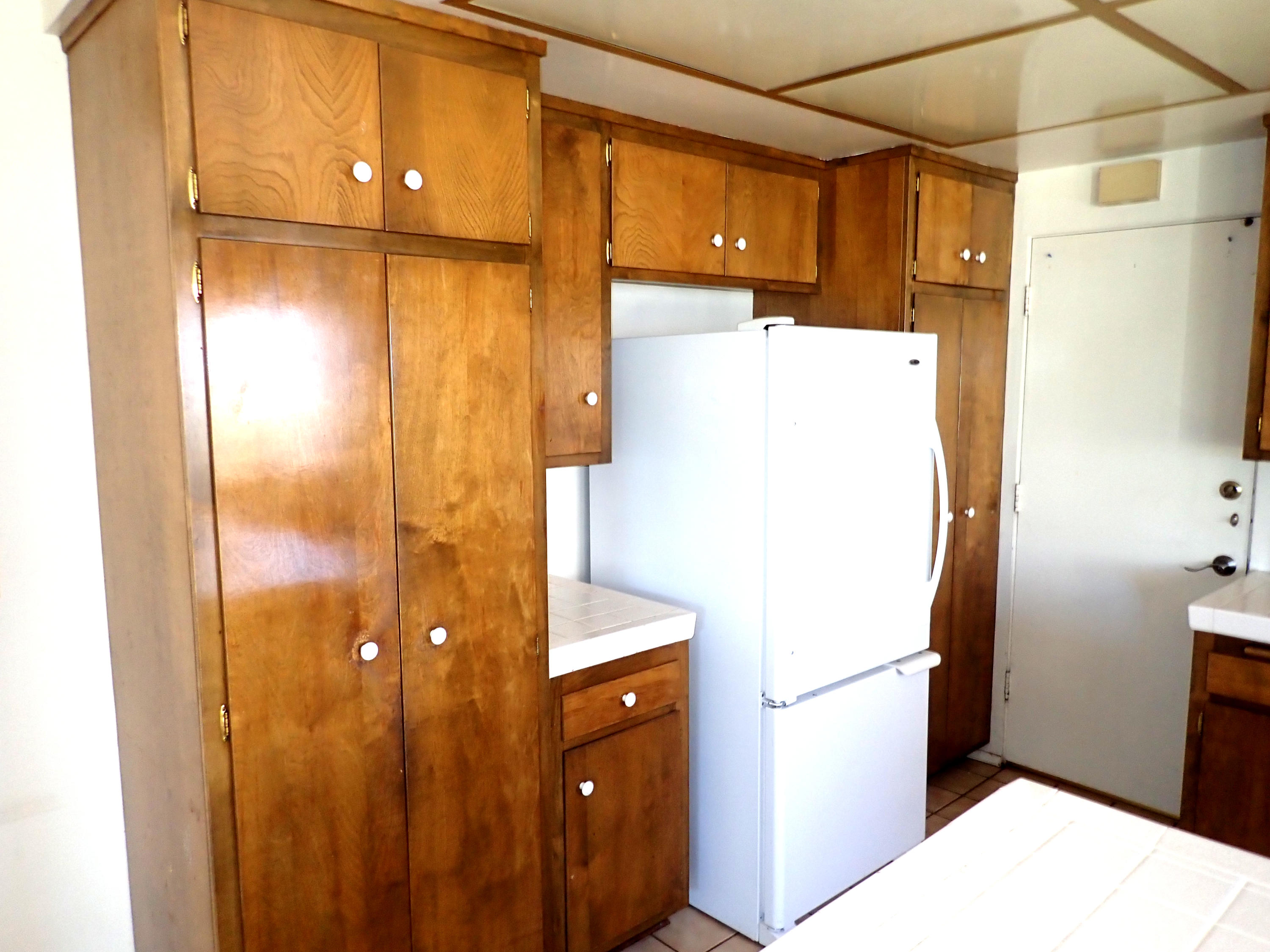 483 Reed Court Goleta, CA 93117 - Photo 12 of 37 a white refrigerator freezer and a microwave