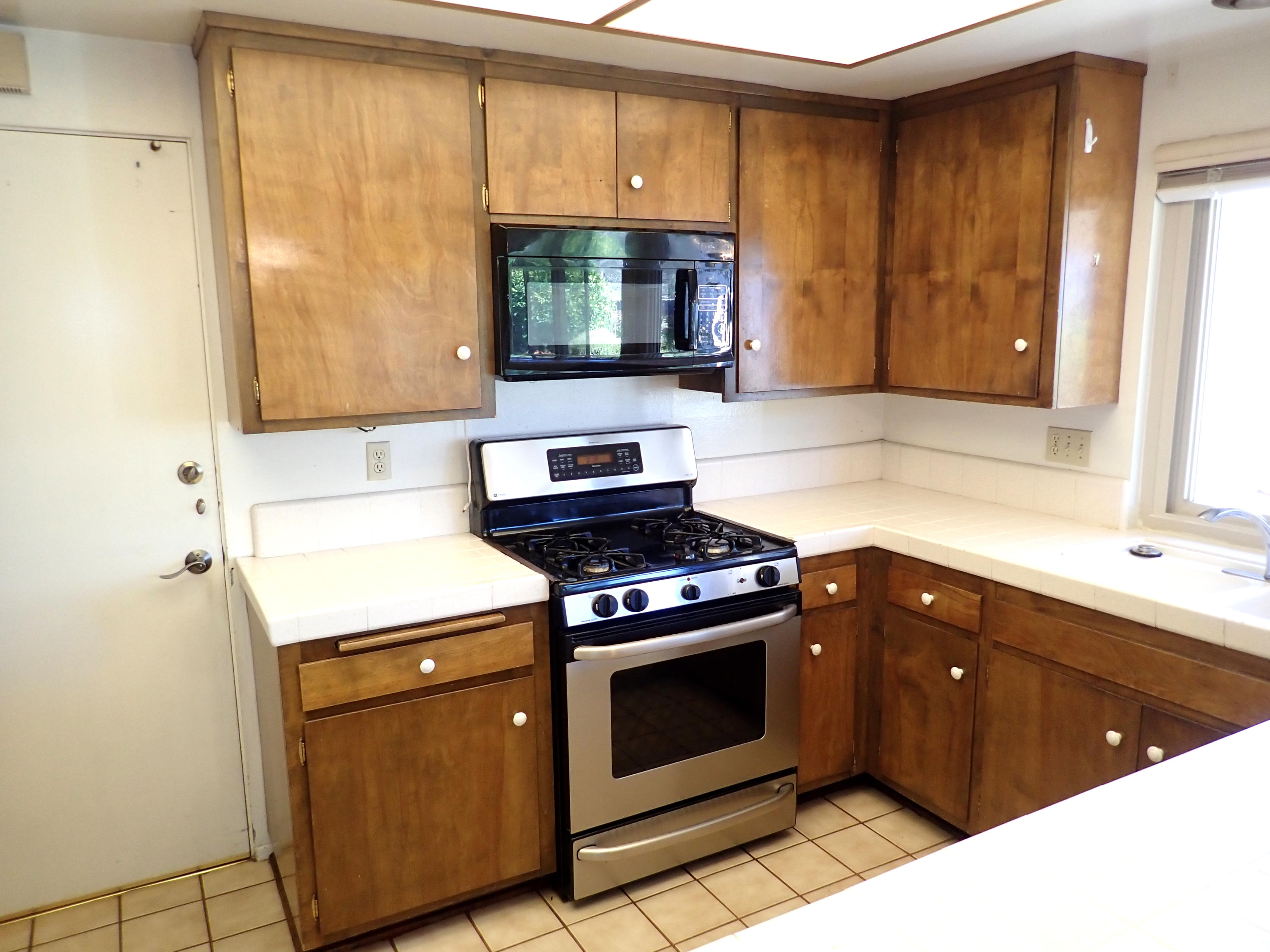 483 Reed Court Goleta, CA 93117 - Photo 13 of 37 a kitchen with a stove and a sink