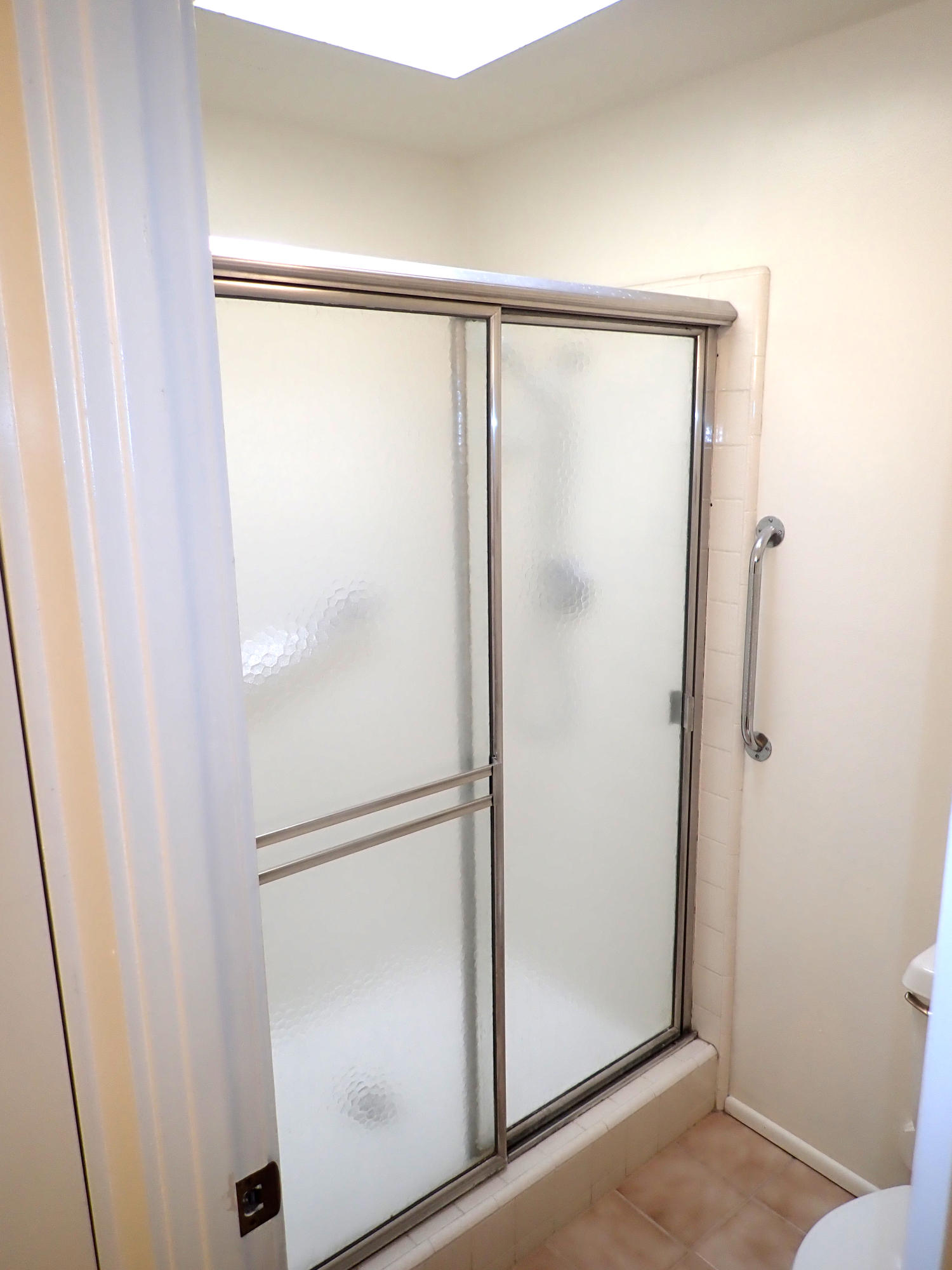 483 Reed Court Goleta, CA 93117 - Photo 19 of 37 a bathroom with a glass shower door