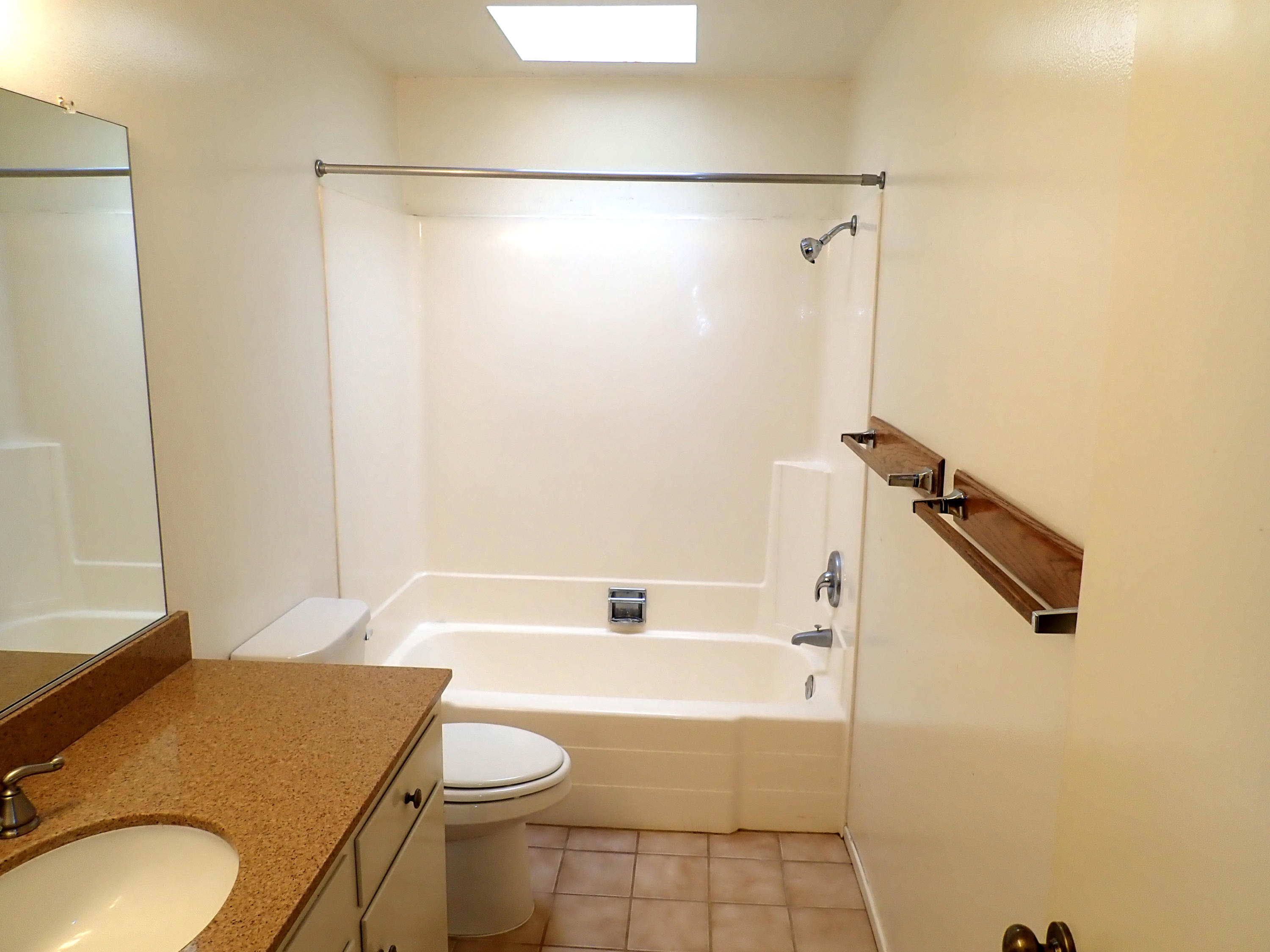 483 Reed Court Goleta, CA 93117 - Photo 22 of 37 a bathroom with a granite countertop sink toilet and shower