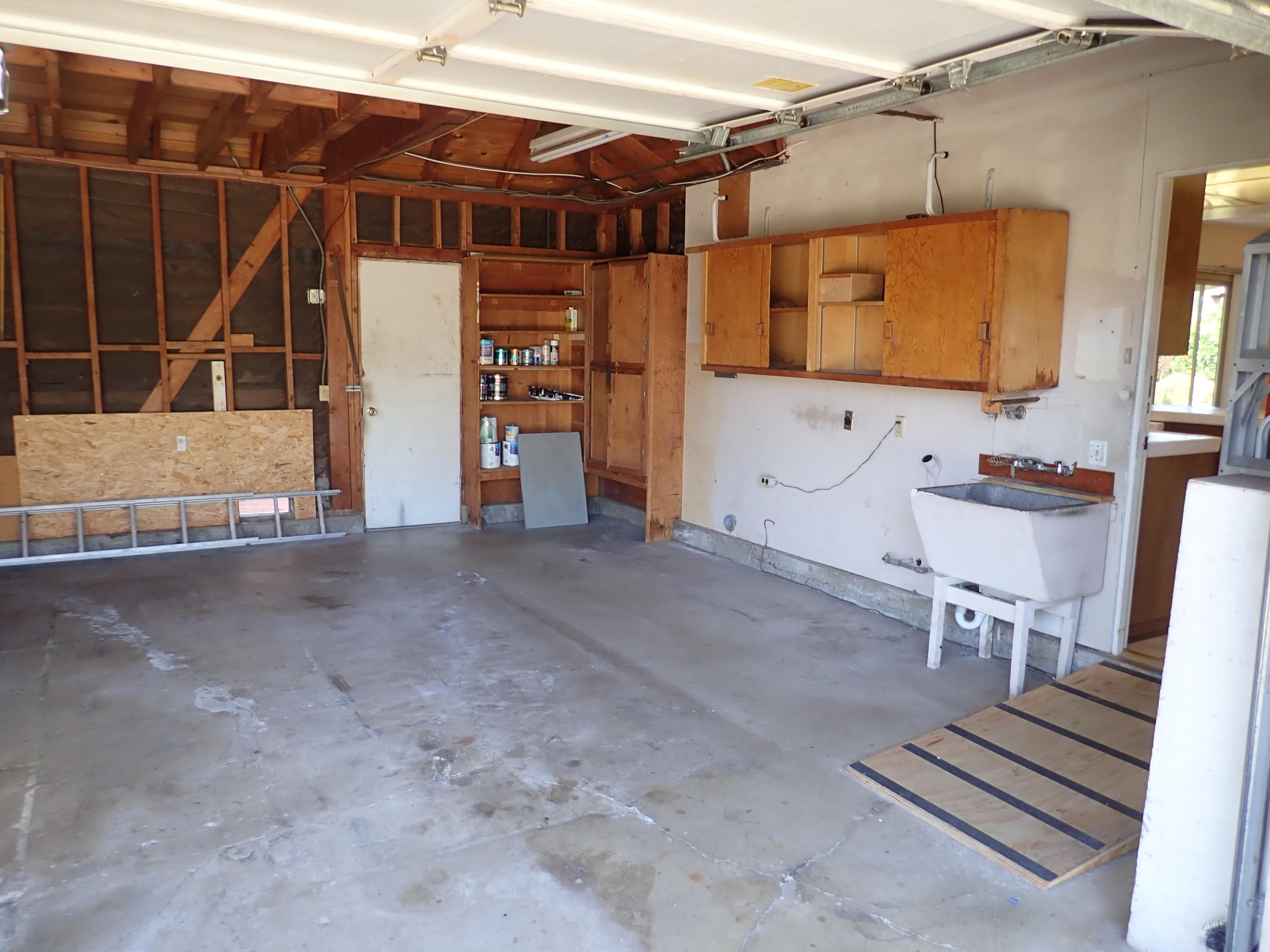 483 Reed Court Goleta, CA 93117 - Photo 31 of 37 a view of a storage room with wooden shelves