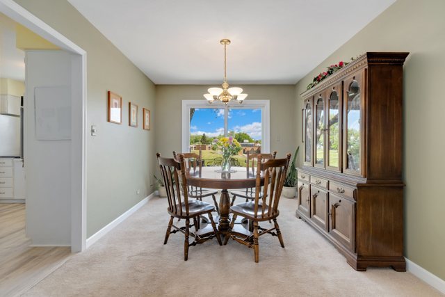 Undisclosed Address Buffalo Grove, IL 60089 - Photo 16 of 30 a view of a dining room with furniture window and outside view