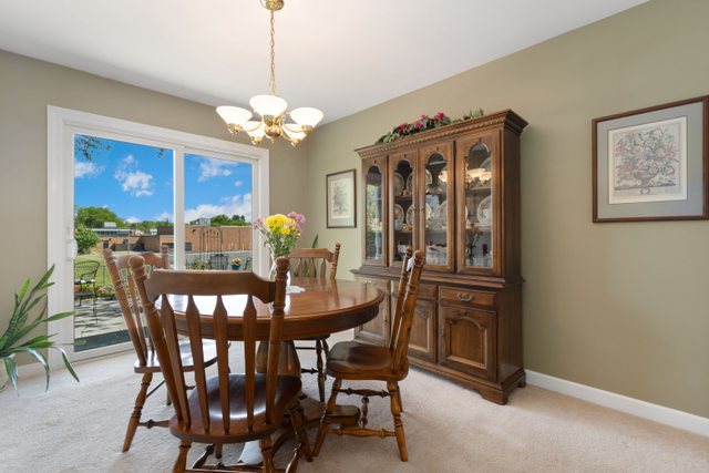 Undisclosed Address Buffalo Grove, IL 60089 - Photo 17 of 30 a view of a dining room with furniture and a chandelier