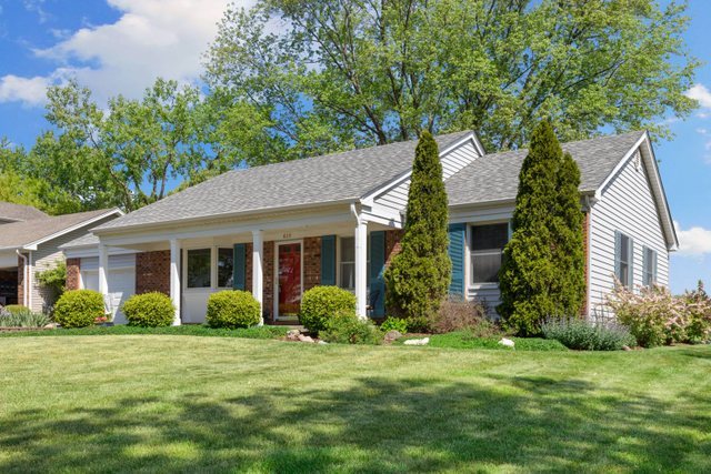 Undisclosed Address Buffalo Grove, IL 60089 - Photo 2 of 30 a view of a house with a yard and potted plants