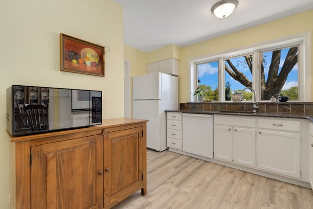 Undisclosed Address Buffalo Grove, IL 60089 - Photo 24 of 30 a kitchen with stainless steel appliances granite countertop a refrigerator and a stove