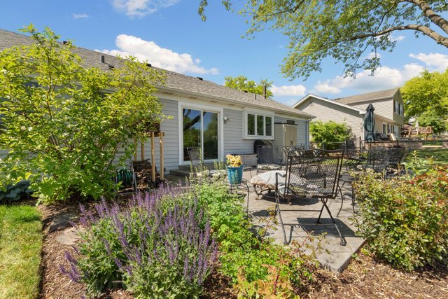 Undisclosed Address Buffalo Grove, IL 60089 - Photo 26 of 30 a view of a patio with table and chairs and potted plants