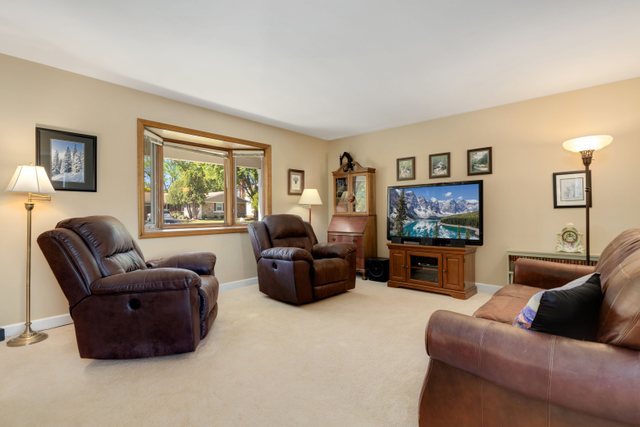 Undisclosed Address Buffalo Grove, IL 60089 - Photo 5 of 30 a living room with furniture and a flat screen tv
