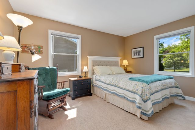 Undisclosed Address Buffalo Grove, IL 60089 - Photo 10 of 30 a bedroom with a bed and large windows