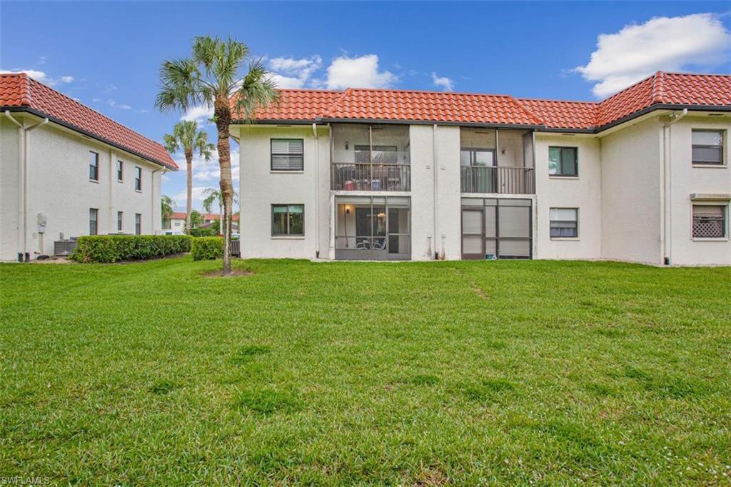 4258 27th Court Southwest, Unit 106 Naples, FL 34116 - Photo 16 of 19 The back of the building offers a lovely view from the lanai