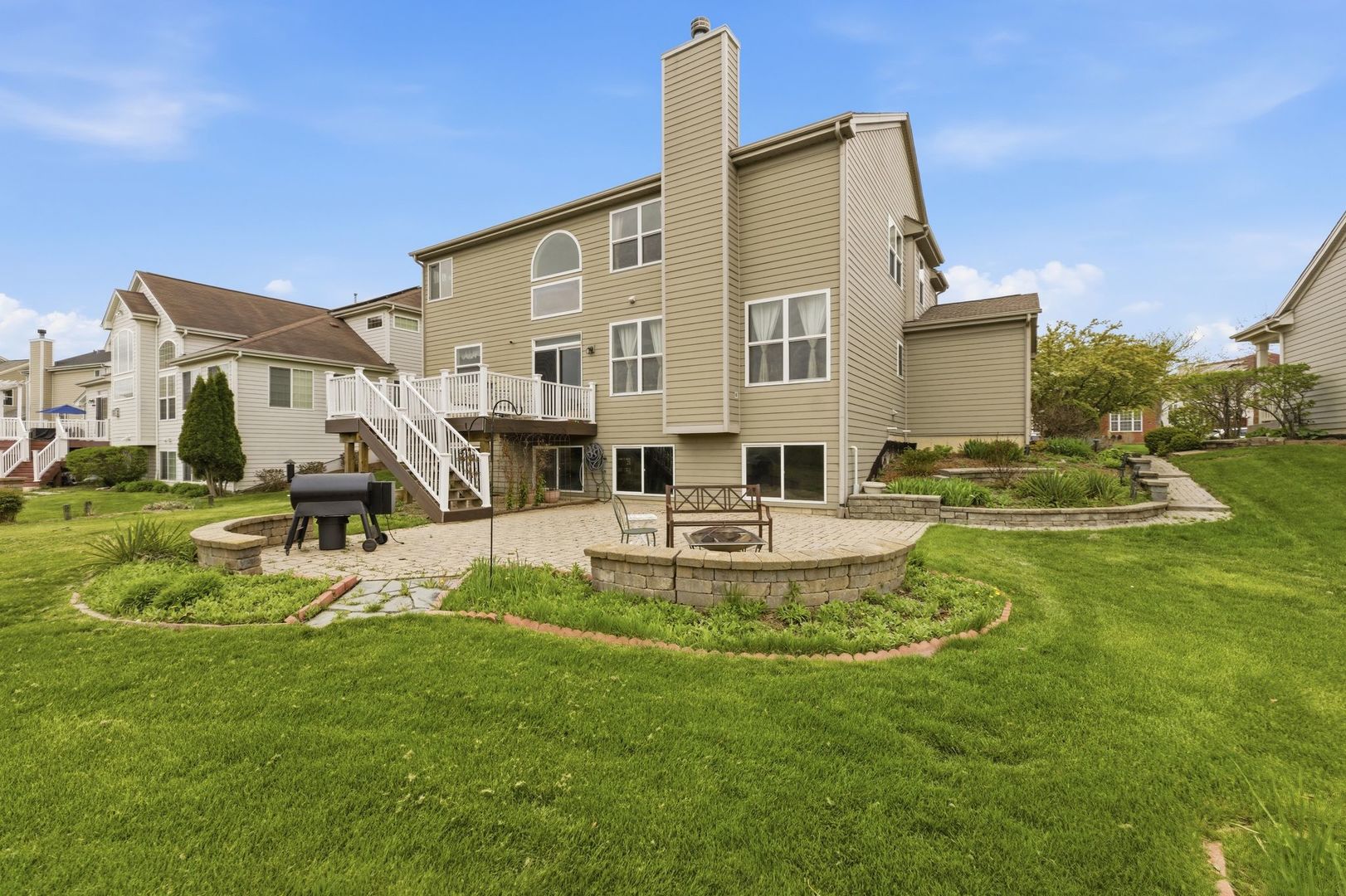 2915 Kelly Drive Elgin, IL 60124 - Photo 28 of 40 a view of a house with a big yard and sitting area