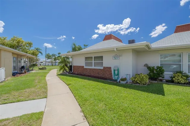 a view of a house with a back yard