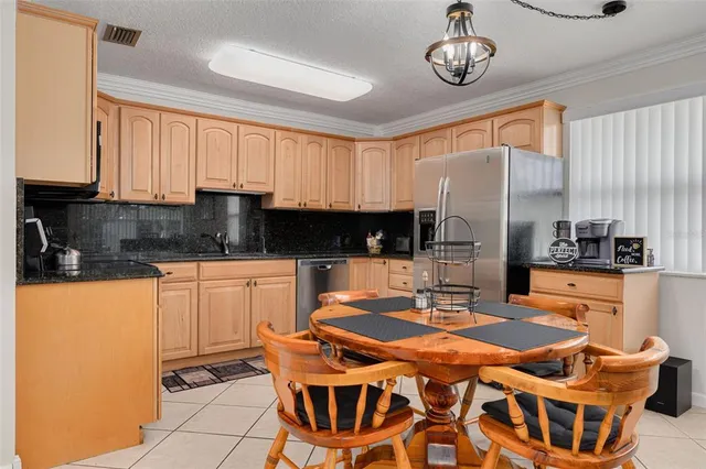 a table and chairs in a kitchen