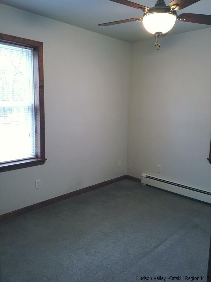 369 New Unionville Road, Unit 1 Wallkill, NY 12589 - Photo 9 of 11 an empty room with a window