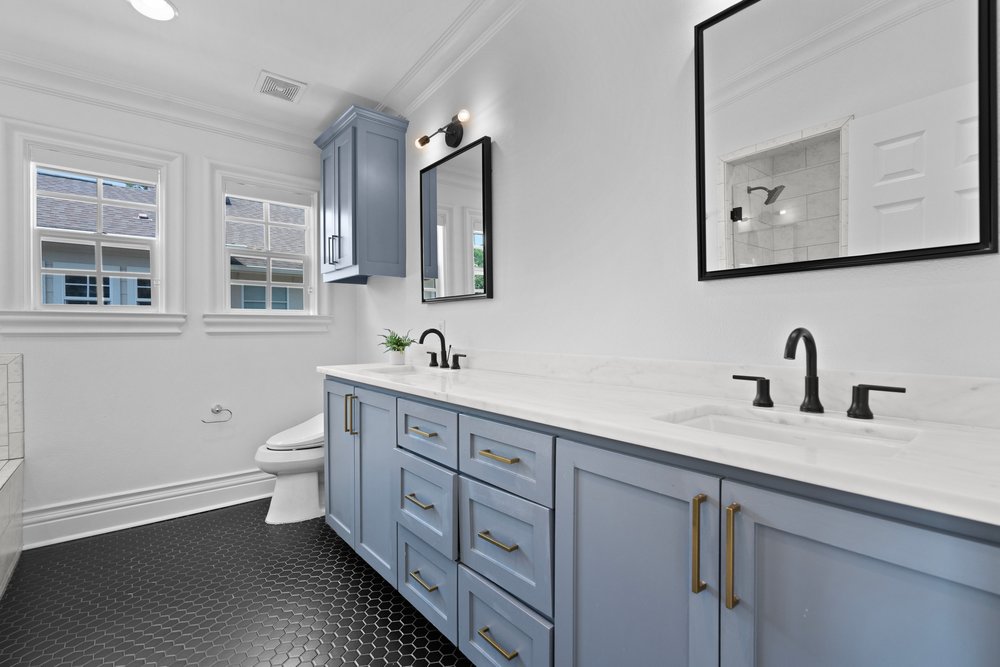 1609 Hartford Road, Unit A Austin, TX 78703 - Photo 27 of 39 A sleek modern vanity with dual sinks, set against a backdrop of crisp white walls.