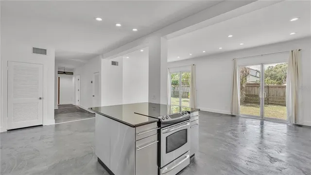 a kitchen that has a sink and a stove