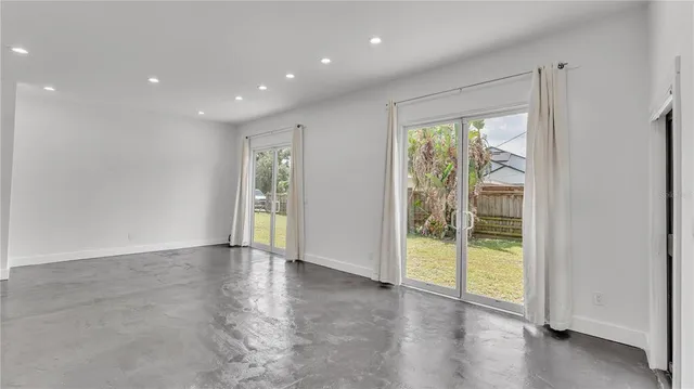 a view of a hallway with white walls