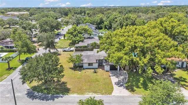 a view of a large building with a garden and plants