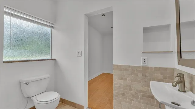 a view of a small space with wooden floor