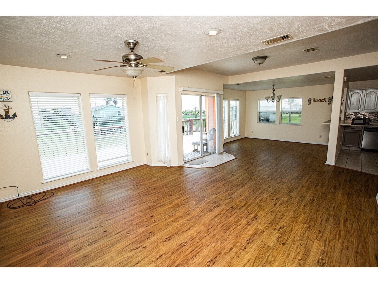419 Thunder Road Surfside Beach, TX 77541 - Photo 6 of 32 Step from the front deck into a spacious, inviting living area with abundant natural light and seamless flow.