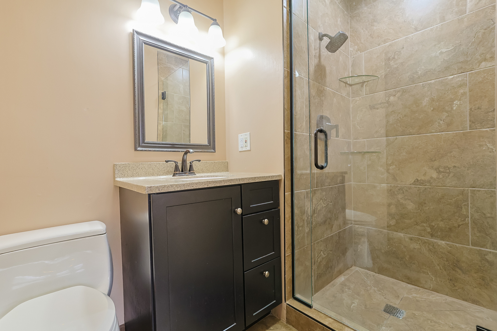 422 Ardmore Road Des Plaines, IL 60016 - Photo 11 of 30 a bathroom with a sink a toilet and shower