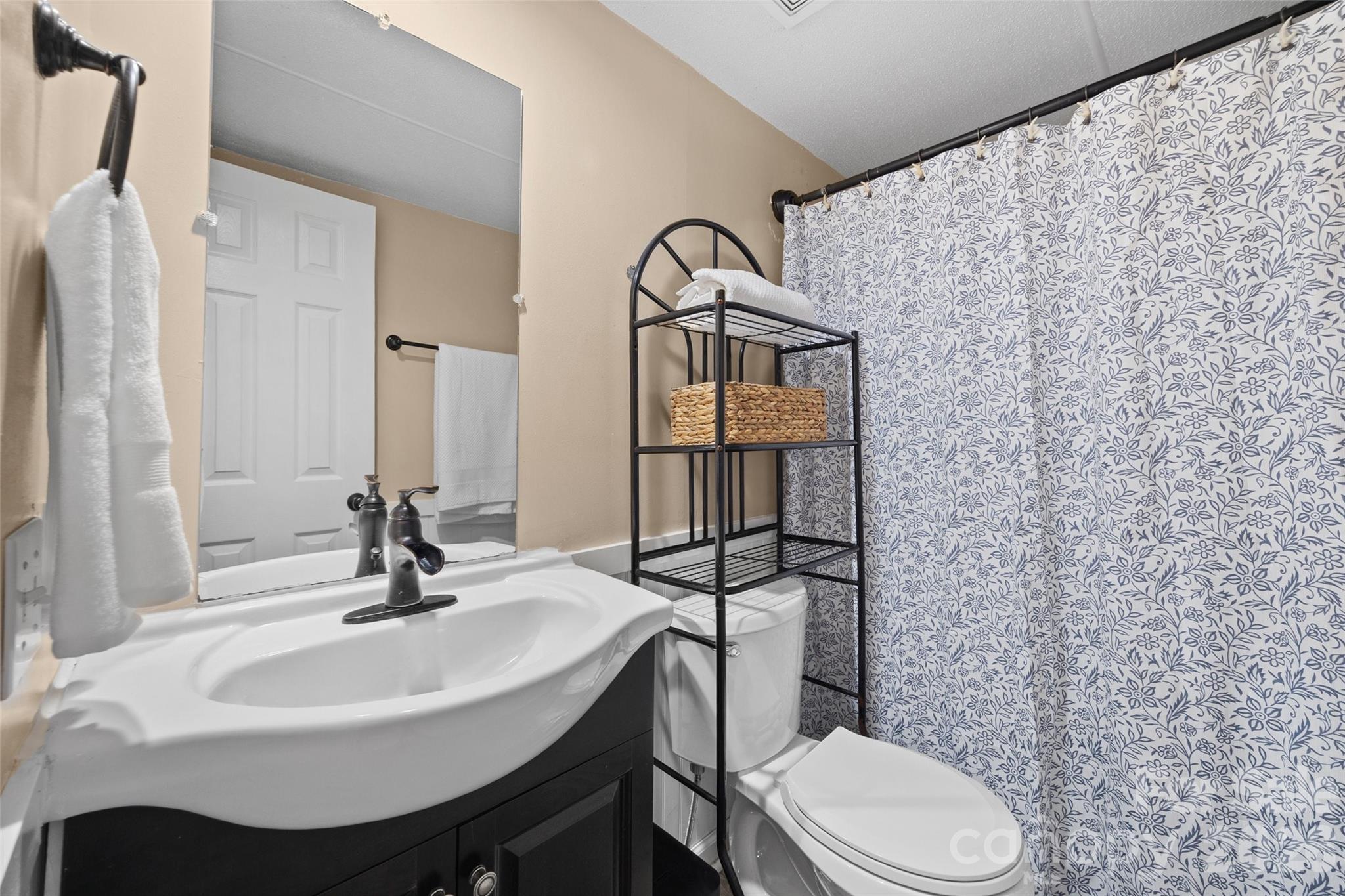 821 Nancys Place Chester, SC 29706 - Photo 12 of 26 a bathroom with a sink toilet and mirror