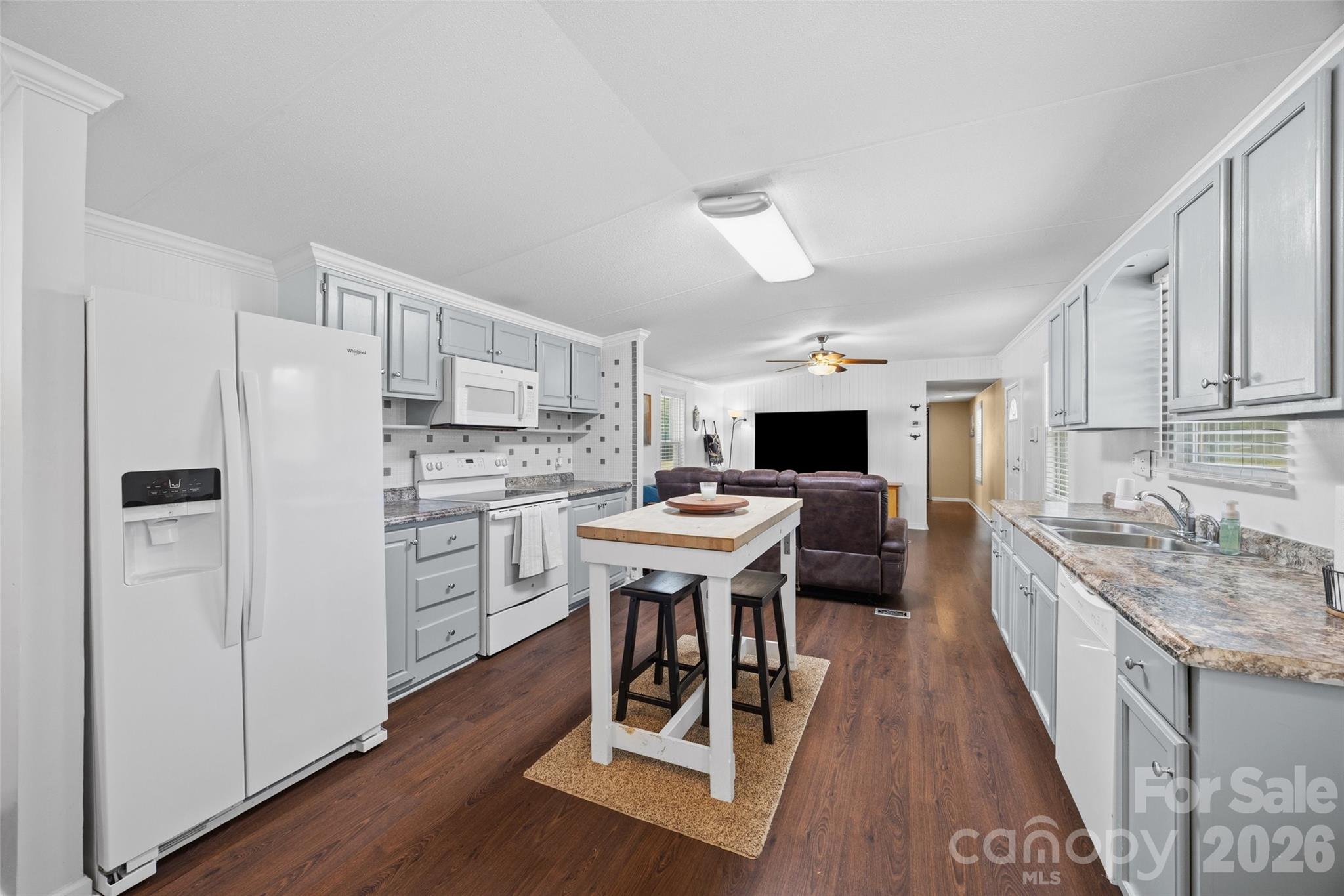 821 Nancys Place Chester, SC 29706 - Photo 5 of 26 a kitchen with white cabinets and stainless steel appliances