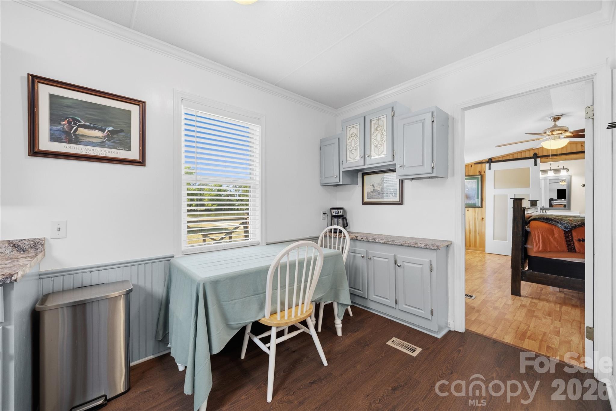 821 Nancys Place Chester, SC 29706 - Photo 6 of 26 a kitchen with stainless steel appliances granite countertop a white cabinets and a stove top oven