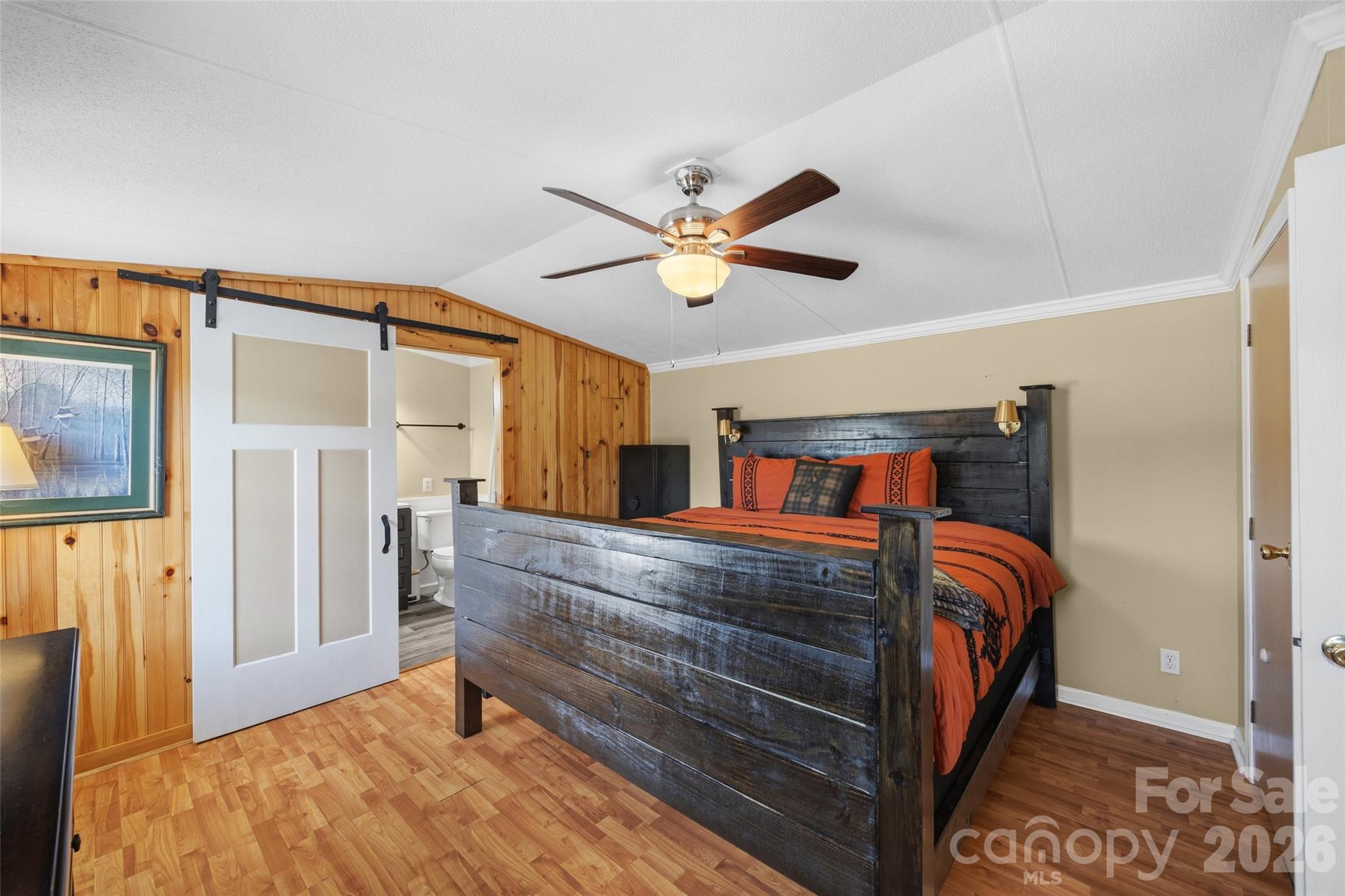 821 Nancys Place Chester, SC 29706 - Photo 7 of 26 a bedroom with a bed and a ceiling fan with a bookshelf