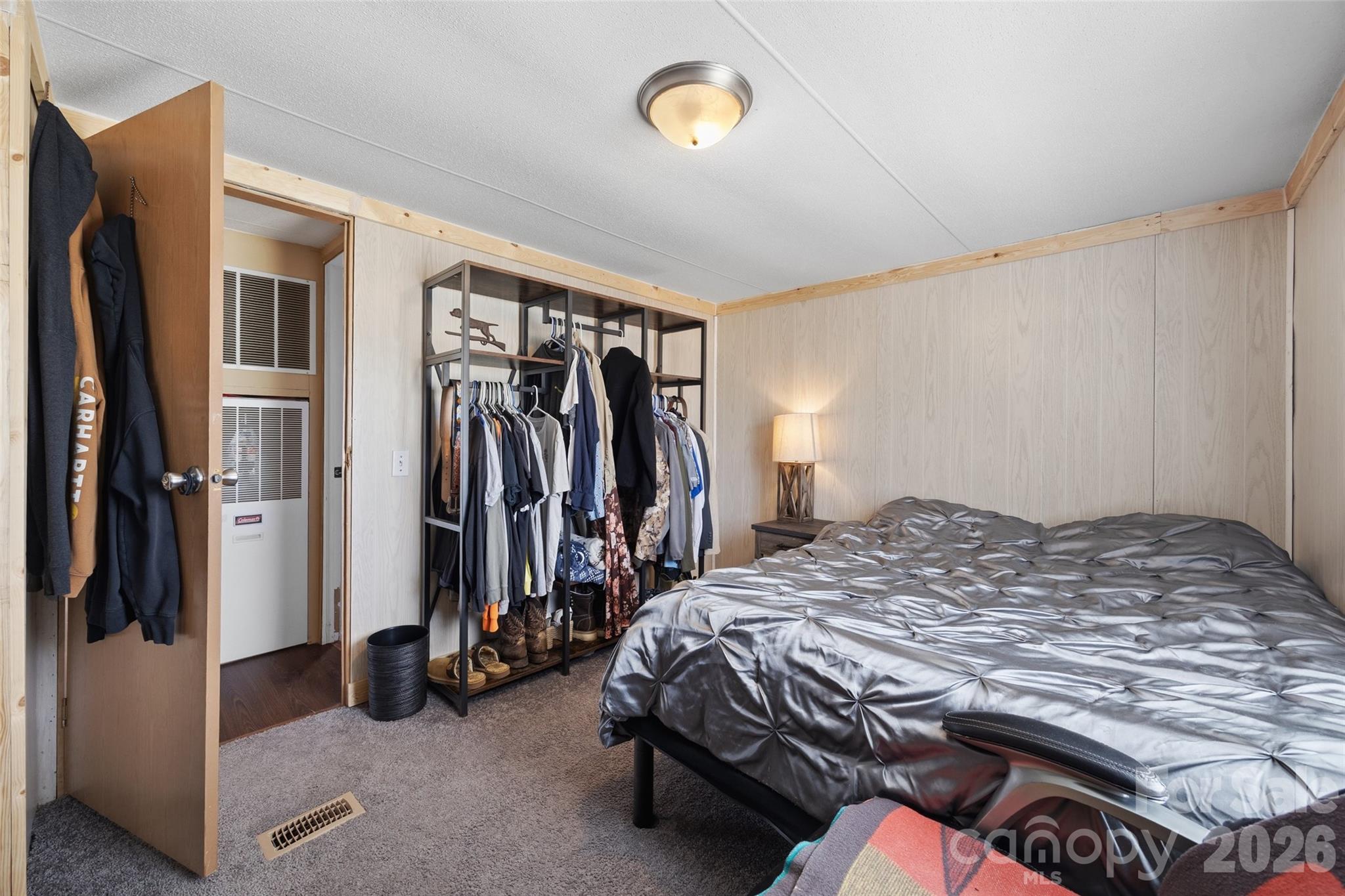 821 Nancys Place Chester, SC 29706 - Photo 10 of 26 a bedroom with a bed and a walk in closet