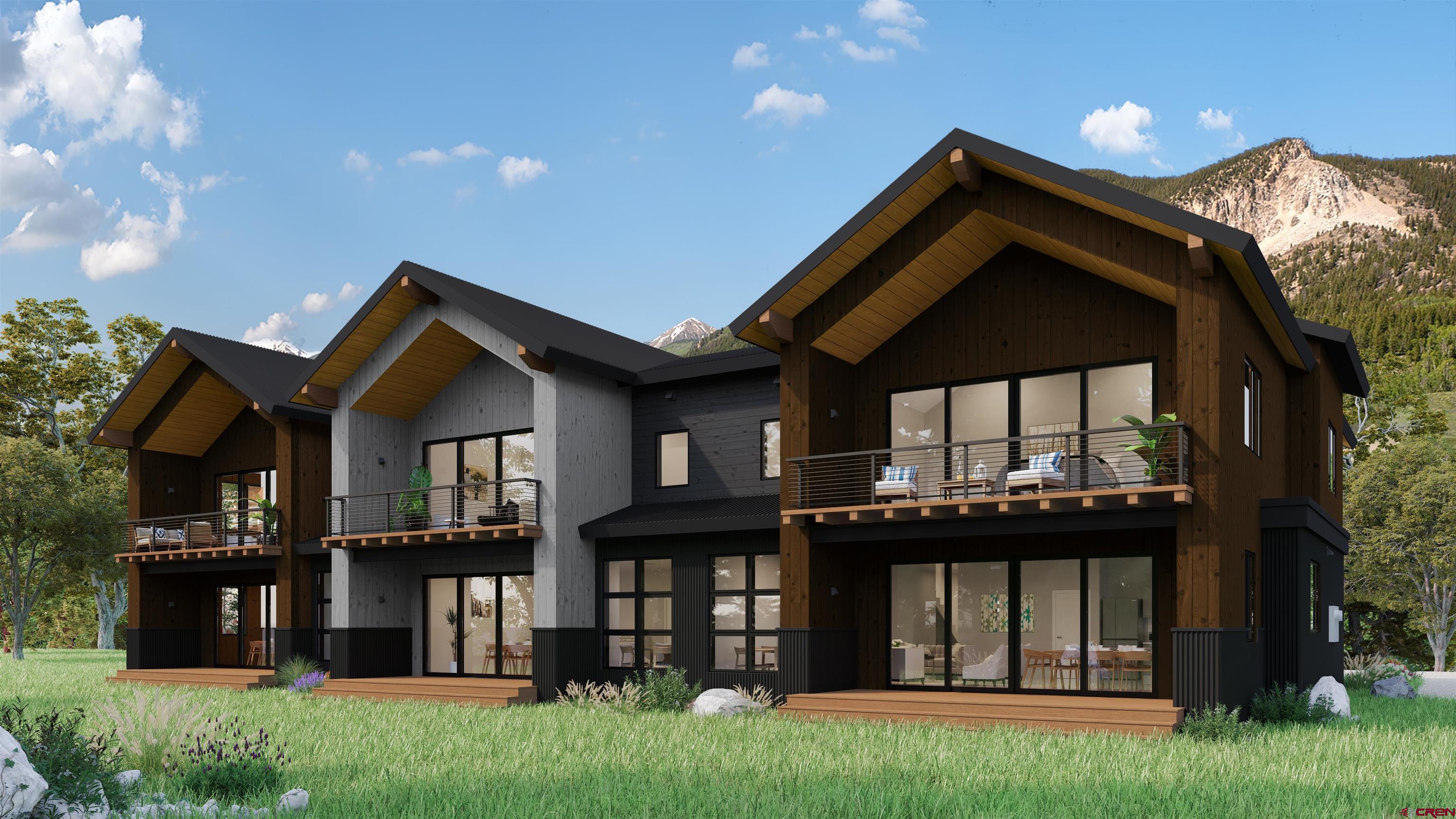 180 Elk Valley Road, Unit 105 Crested Butte, CO 81224 - Photo 26 of 35 a front view of a house with a garden and plants