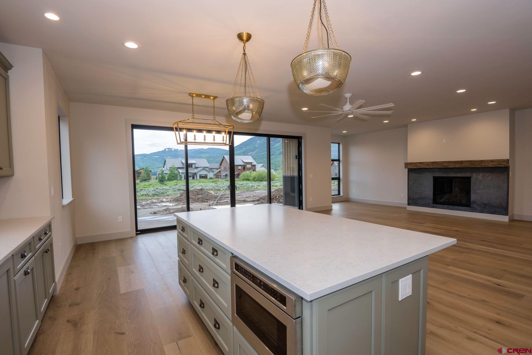 180 Elk Valley Road, Unit 105 Crested Butte, CO 81224 - Photo 4 of 35 a large kitchen with kitchen island a large island in it